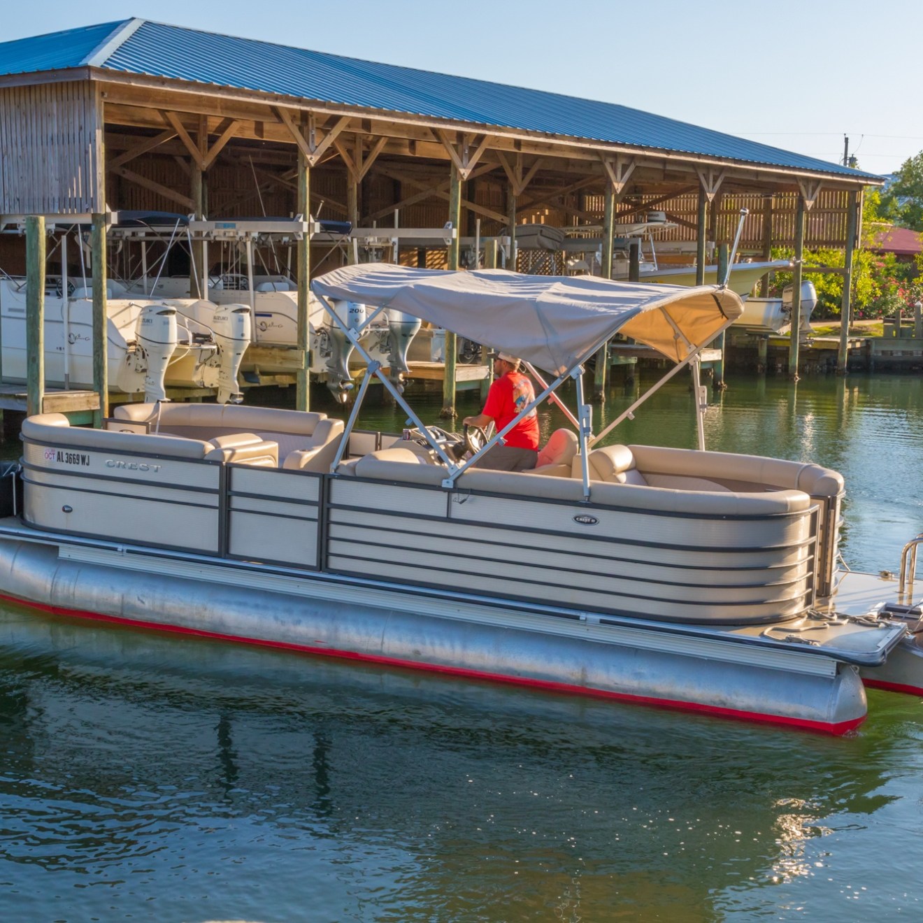 a boat is docked next to a body of water
