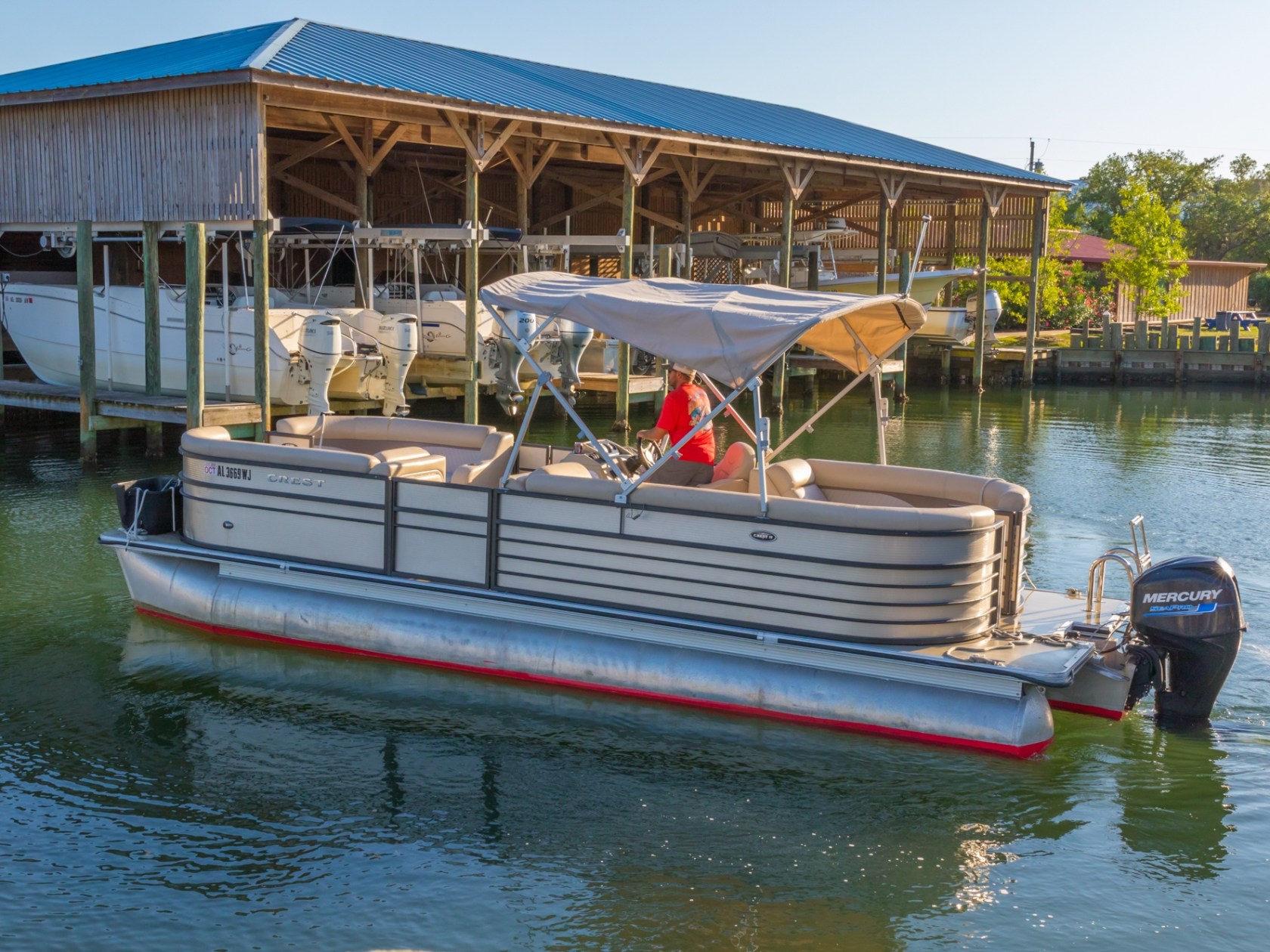 a boat is docked next to a body of water