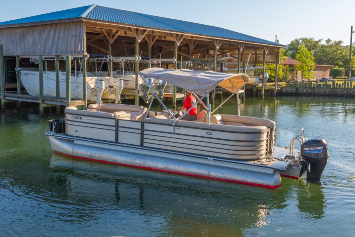 a boat is docked next to a body of water