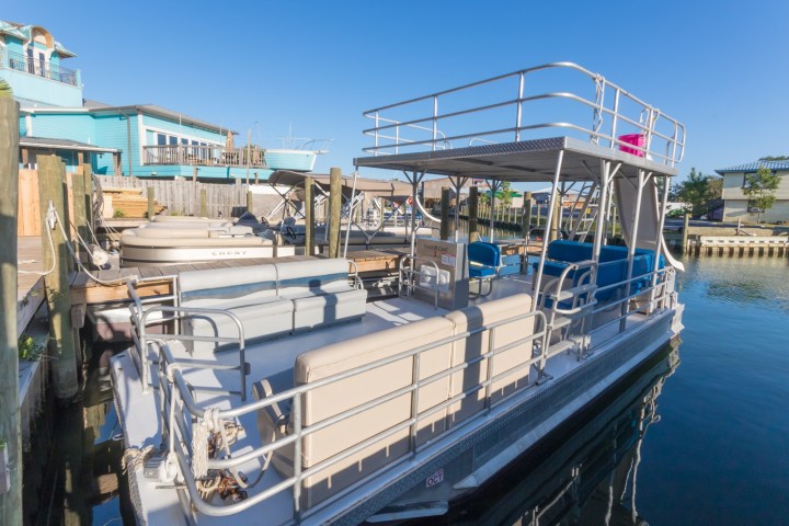 a boat is docked next to a body of water