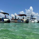 a group of people on a boat in the water