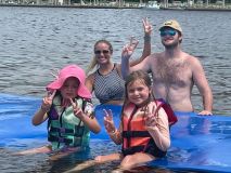 a group of people swimming in a body of water