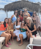 a group of people sitting posing for the camera