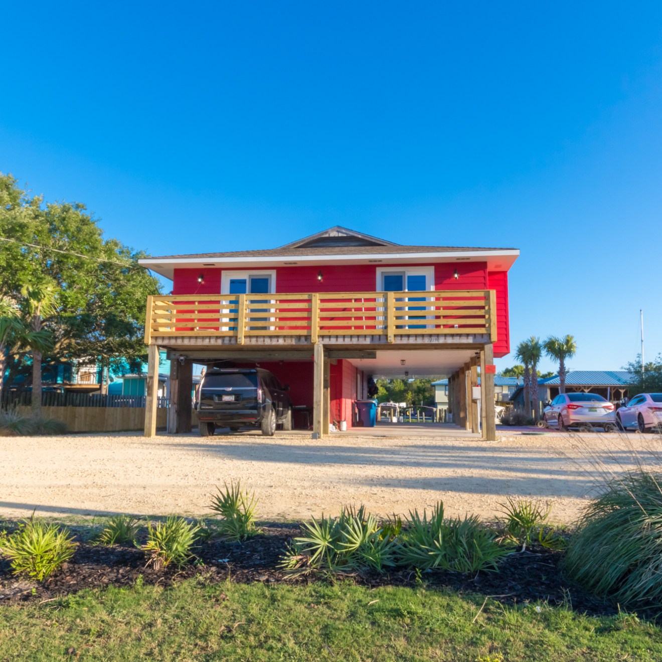 a group of palm trees on the side of a building