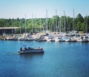 a small boat in a harbor next to a body of water
